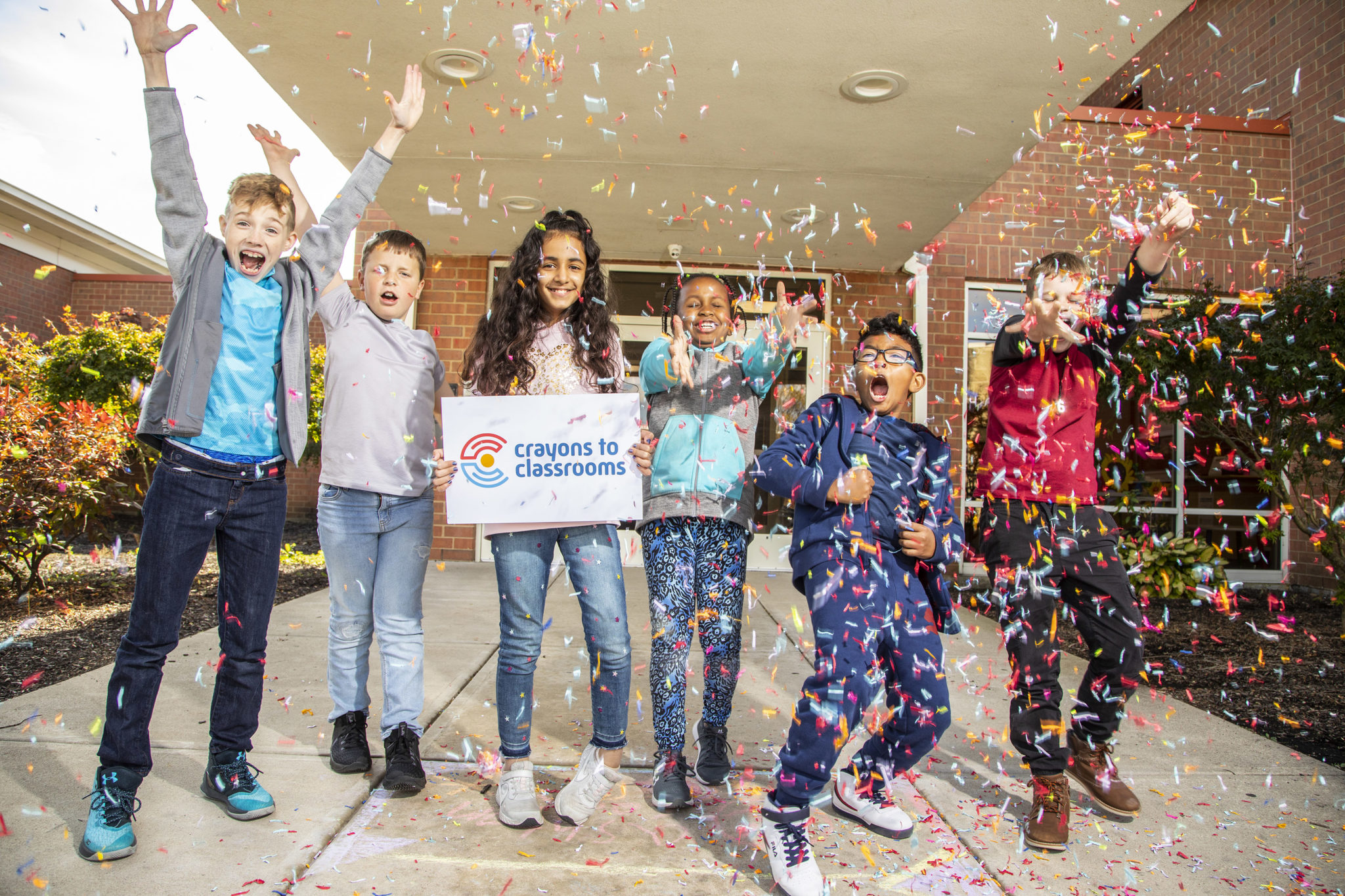 Volunteers Crayons To Classrooms